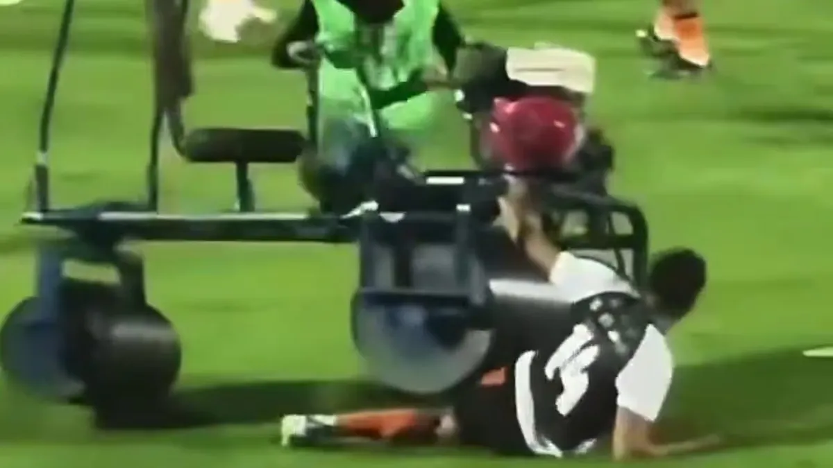 Bizarre moment former Premier League star is RUN OVER by a pitch rolling machine at half-time during match in Thailand
