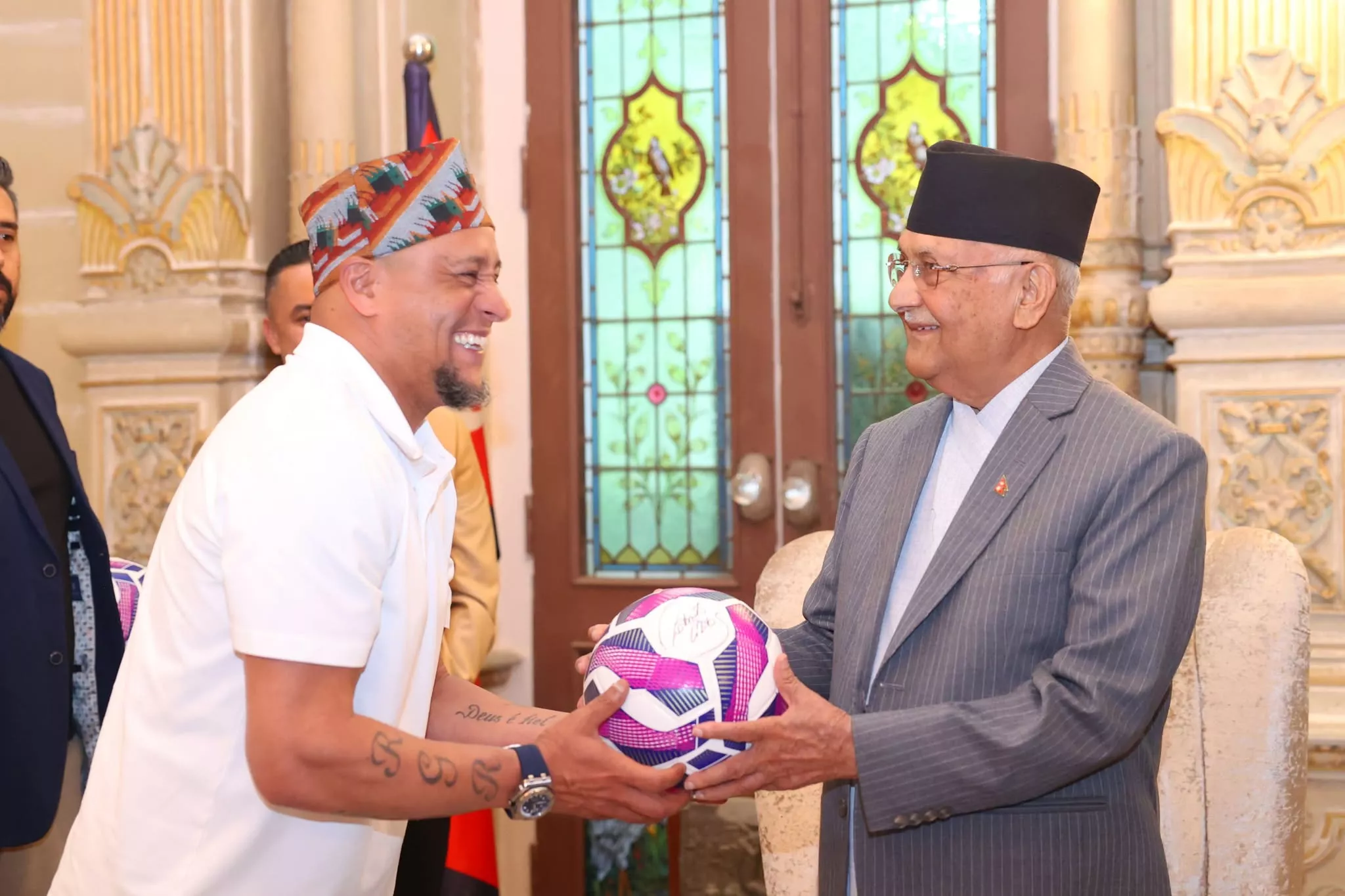 PM Oli meets Brazilian football legend Roberto Carlos