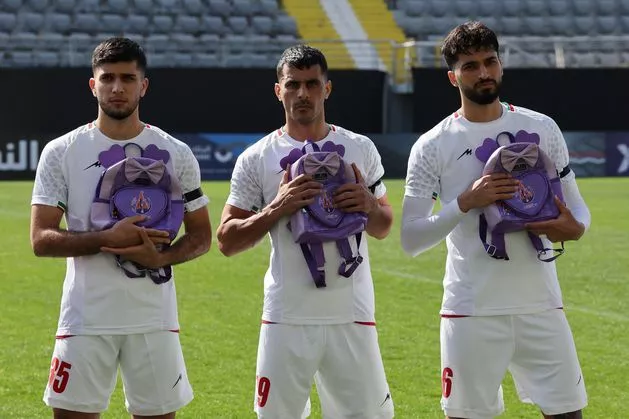 Iranian players hold schoolbags in solidarity with slain girls before friendly in Turkey